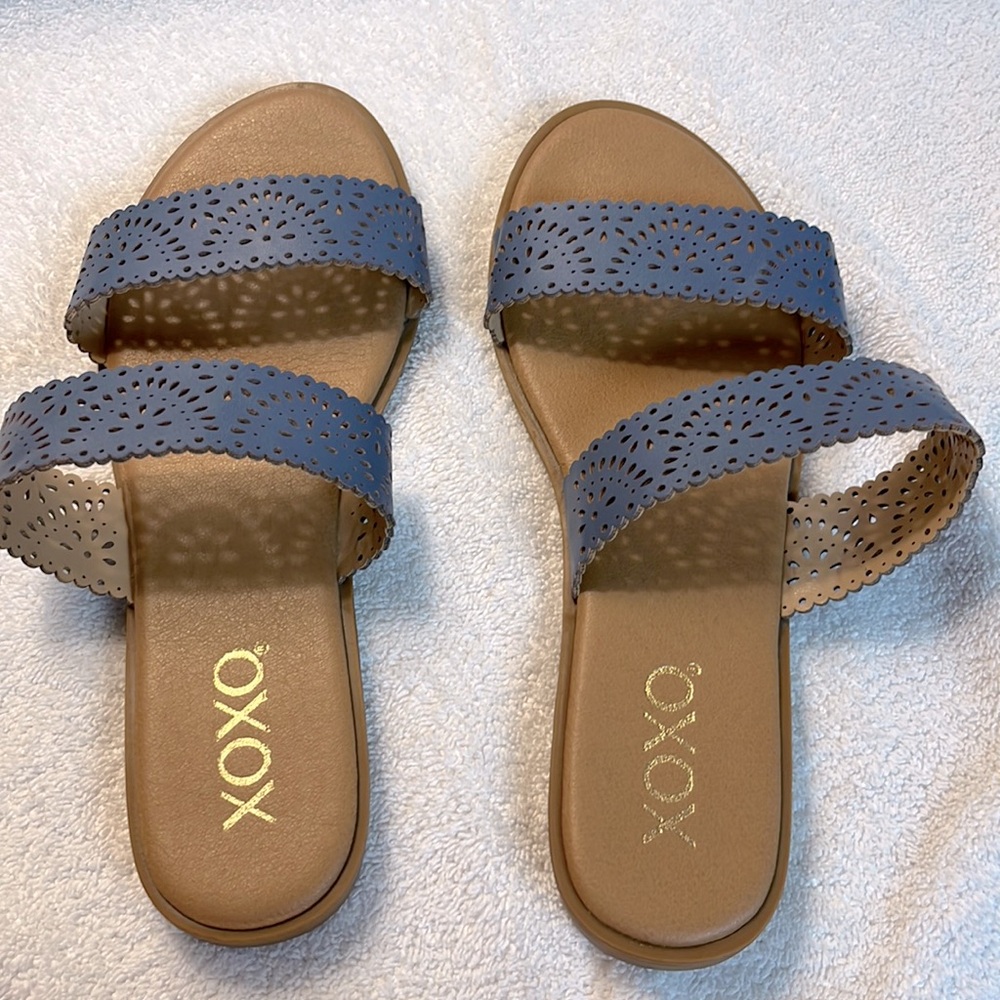 Sandals are from the brand XOXO and are in the color blue. Great condition.